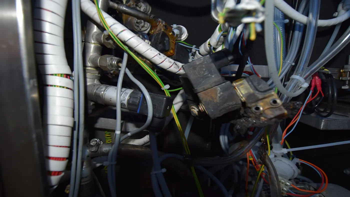 Jammed solenoid that overheated, contained by suppression